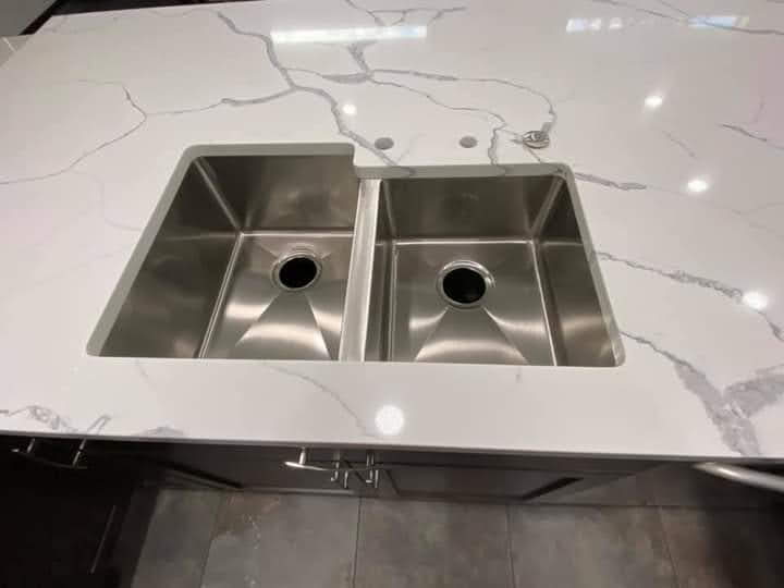 Calacatta quartz countertop with double-bowl stainless undermount sink